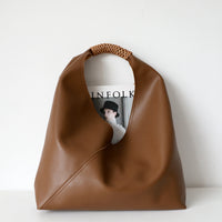Spliced woven shoulder bag